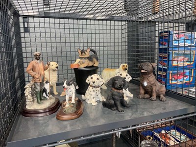 Lot 5505 - Cage containing figures modelled as dogs
