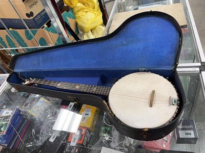 Lot 2374 - Banjo in a case