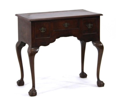 Lot 10 - A George III mahogany and crossbanded lowboy,...