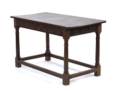 Lot 14 - An oak refectory type table, the planked...