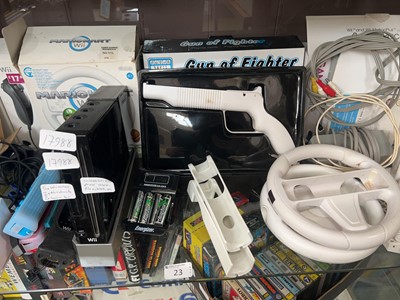 Lot 23 - A shelf containing a Nintendo Wii console with...