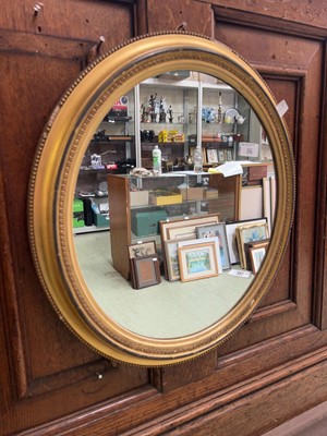 Lot 36 - An oval gilt framed wall mirror