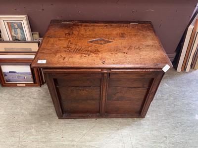 Lot 41 - An oak and stained ply trunk with lift lid