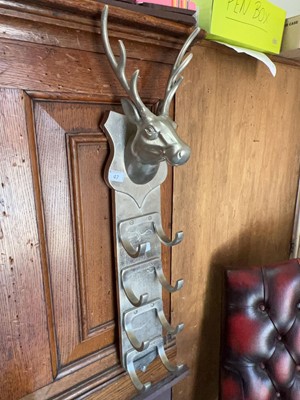 Lot 47 - A contemporary set of wall hooks surmounted by...