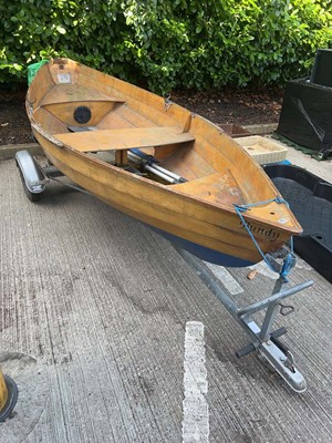Lot 4257 - Wooden rowing boat with single-axle boat...