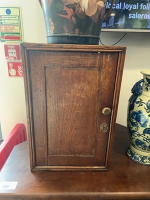 Lot 1003 - Small dark oak single door pot cupboard