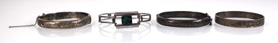 Lot 318 - Four silver hinged bracelets, one maker JS,...