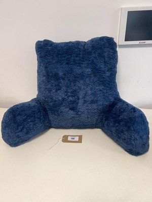Lot 1142 - A blue faux fur reading pillow with arms