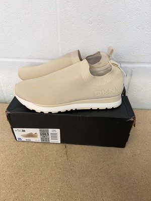 Lot 1283 - Boxed pair of DKNY slip on trainers size UK 7