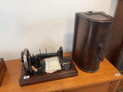 Lot 1021 - Singer manual powered sewing machine in fitted...