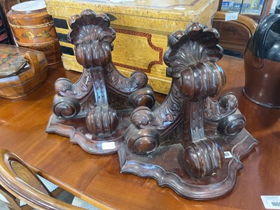 Lot 1063 - Pair of heavily carved mahogany wall sconces