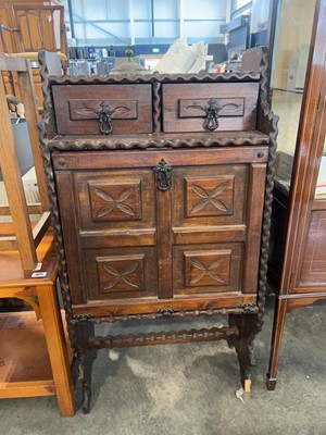 Lot 1069 - Dark oak old charm style fall front cabinet...