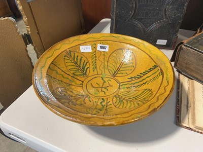 Lot 1087 - Terracotta bowl painted naïvely with yellow glaze