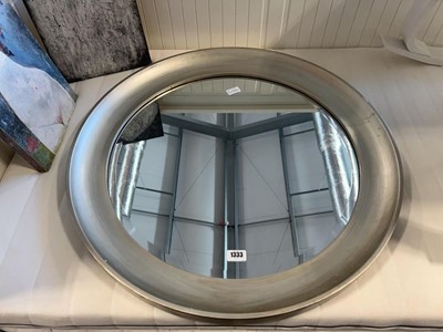 Lot 1333 - Circular beveled wall mirror set within silver...