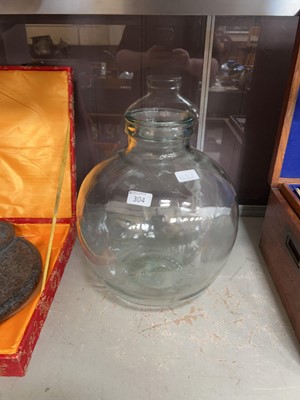 Lot 304 - A clear glass carboy