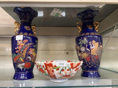 Lot 308 - A pair of oriental blue and gilt twin handled...