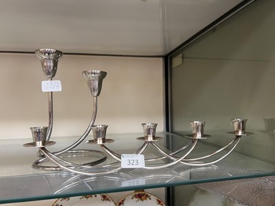 Lot 323 - A plated Georg Jensen style twin candle stick...