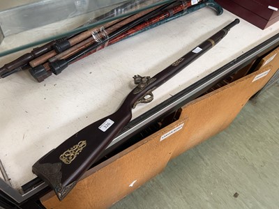 Lot 326 - A replica musket with brass decoration