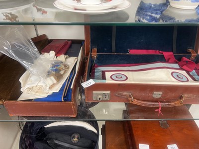 Lot 337 - Two tan leather cases containing an assortment...