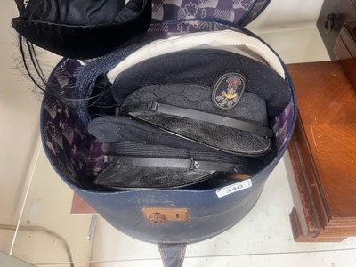 Lot 340 - A leather bound hat box containing an...