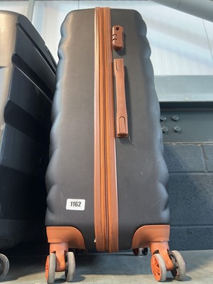 Lot 1162 - Hard shell wheeled luggage case in black/brown