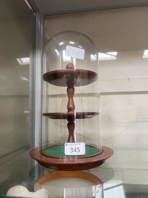 Lot 345 - A stained wood three tier display stand under...