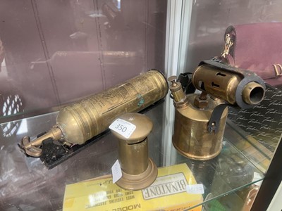 Lot 350 - A brass desktop money bank along with a...