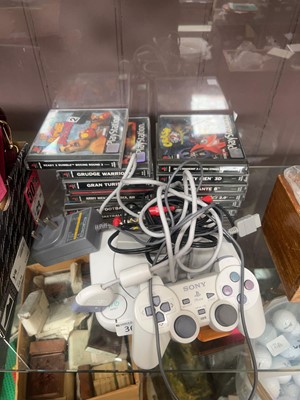 Lot 361 - A Sony PlayStation 1 console with controller,...
