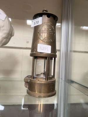 Lot 370 - A 20th century brass cased miner's lamp type 6...