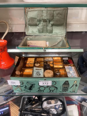 Lot 372 - A wicker sewing box and a tin sewing box, both...