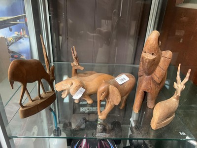 Lot 388 - Six carved African models of animals (A/F)