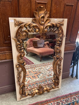 Lot 17 - An ornate gilt framed wall mirror with...