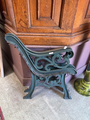 Lot 19 - A pair of green painted bench ends