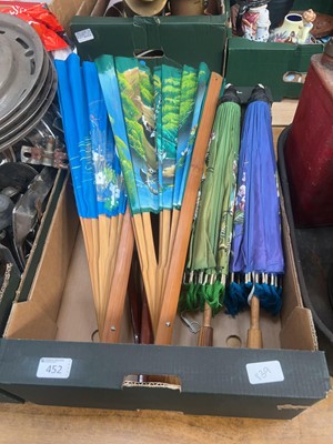 Lot 452 - A tray containing three oriental hand fans and...