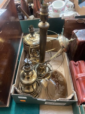 Lot 411 - A box containing three brass table lamps, one...