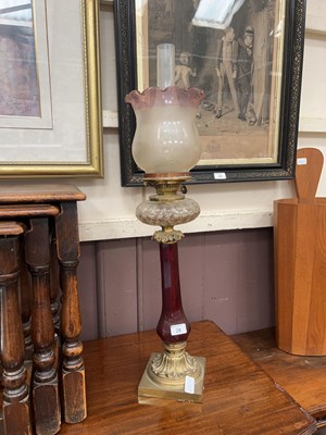 Lot 28 - An ornate brass and glass oil lamp with...