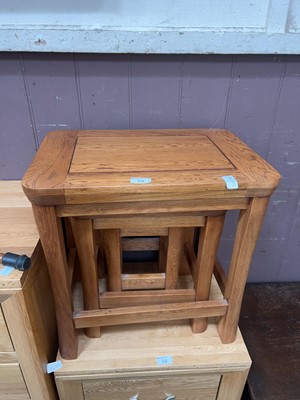 Lot 53 - A modern oak nest of three occasional tables...