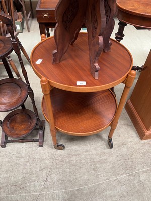 Lot 88 - A circular teak tea trolley with under tier