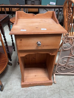 Lot 89 - A stripped pine bedside chest with single...