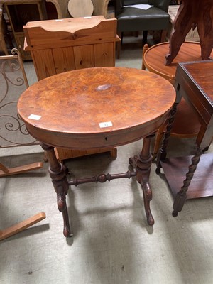 Lot 93 - A burr walnut oval top sewing table on turned...