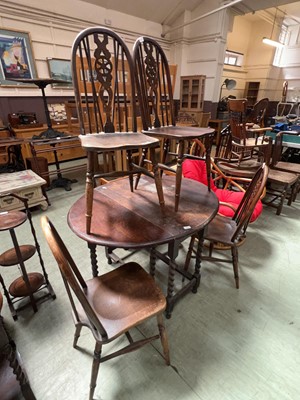 Lot 95 - A distressed 20th century oak gate leg dining...