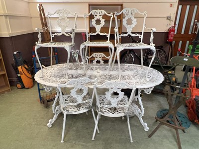 Lot 101 - A white painted oval top cast metal garden...