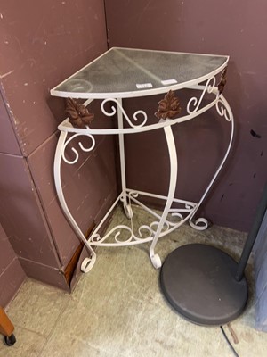 Lot 116 - A white metalwork glass topped corner table