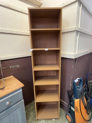 Lot 120 - An oak veneered slimline full height bookcase