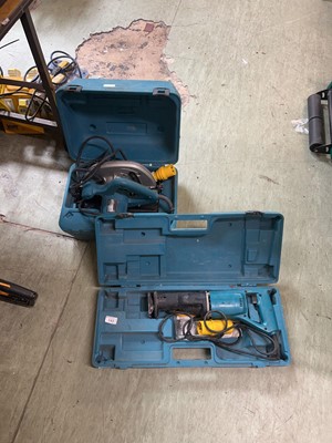 Lot 143 - A cased Makita model 5704R circular saw along...