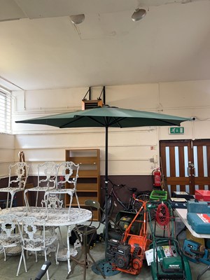 Lot 146 - A green parasol on green cast metal base