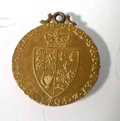 Lot 404 - A mounted George III gold 'Spade' Guinea dated...
