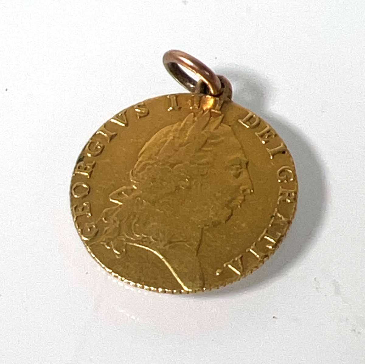 Lot 405 - A mounted George III gold 'Spade' Guinea dated...