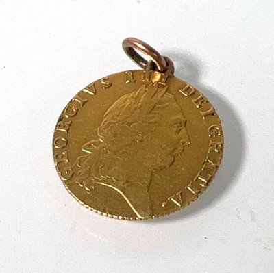 Lot 405 - A mounted George III gold 'Spade' Guinea dated...