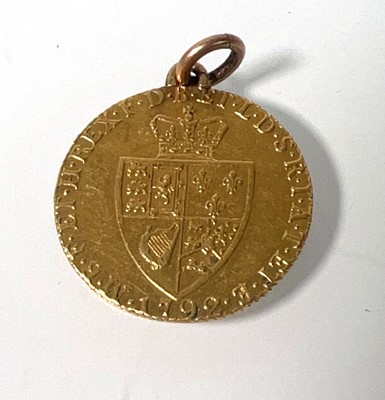 Lot 405 - A mounted George III gold 'Spade' Guinea dated...